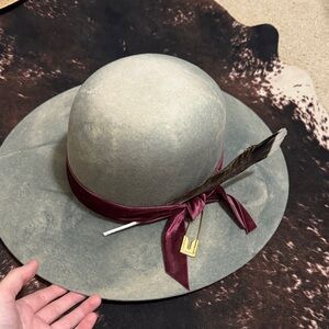 Elegant Gray Wide-Brim Hat with Burgundy Ribbon
Renegade hat wear